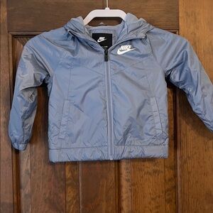 Nike Childs light gray jacket with fleece lining, side pockets and hood. 3T.